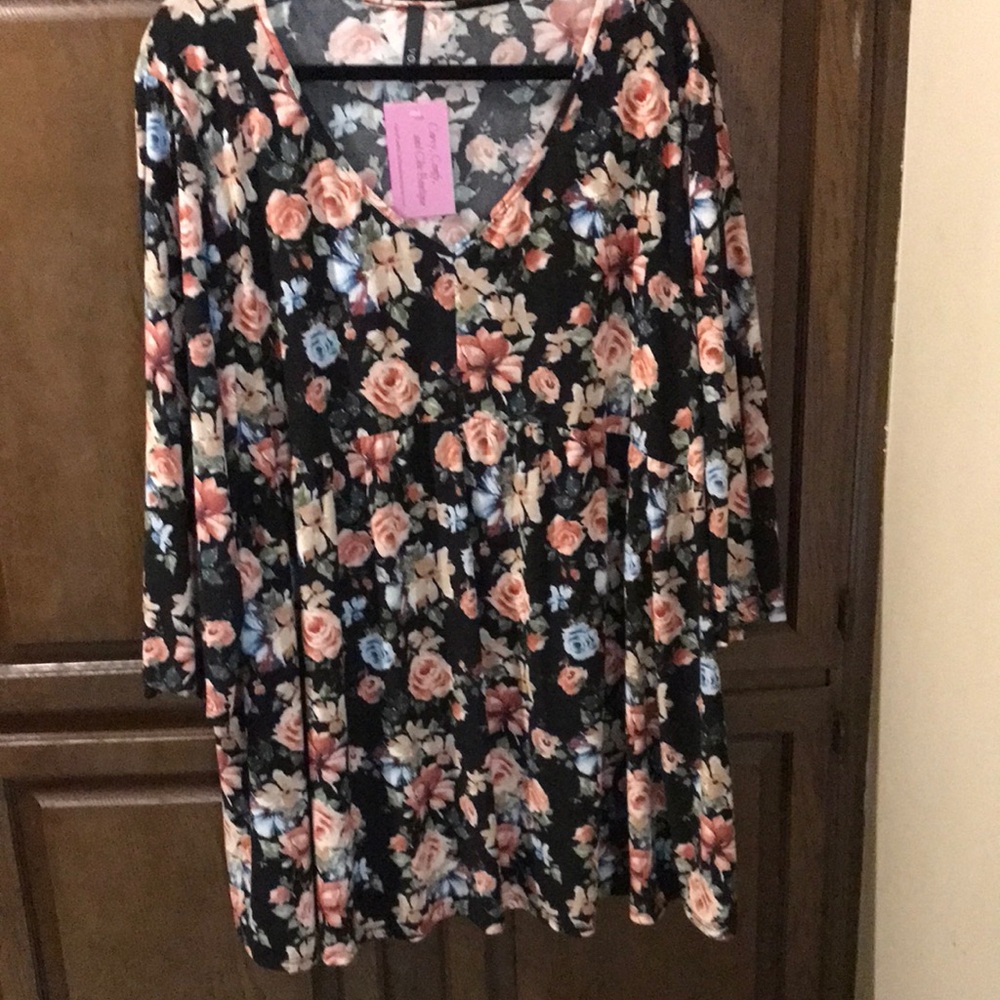 Brand new with tag V Neck Tunic Top. Black with floral pattern. Size 5XL